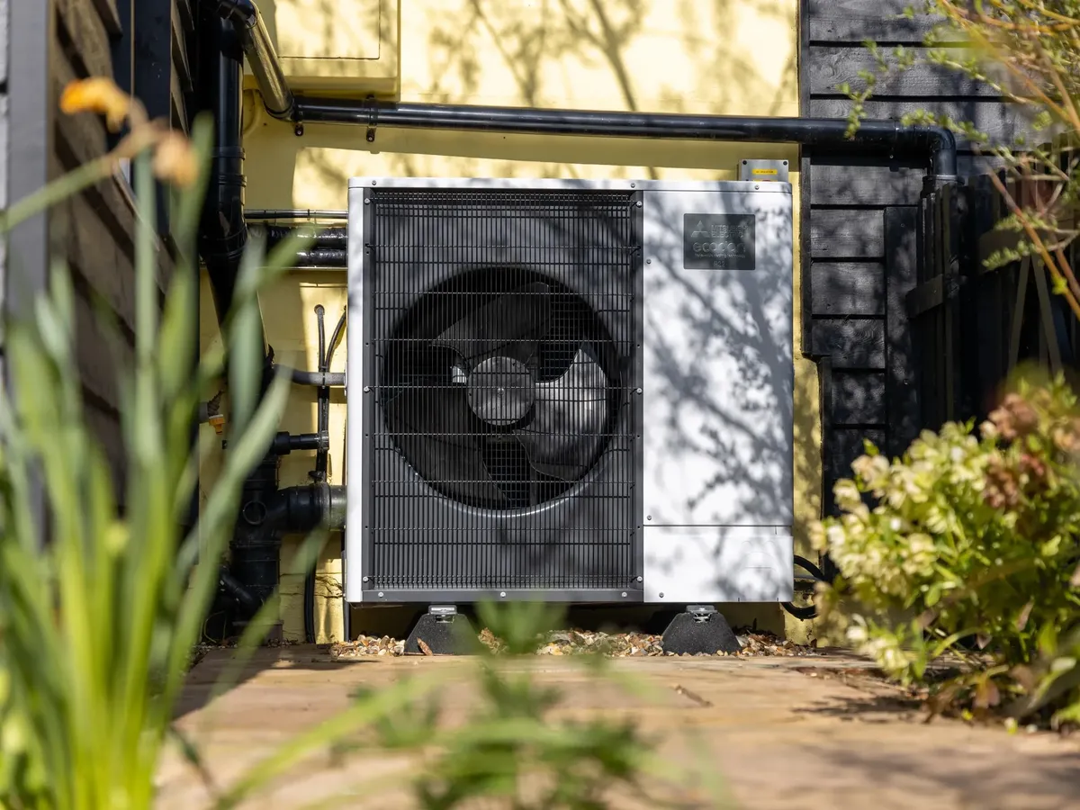 Air source heat pump outside a home