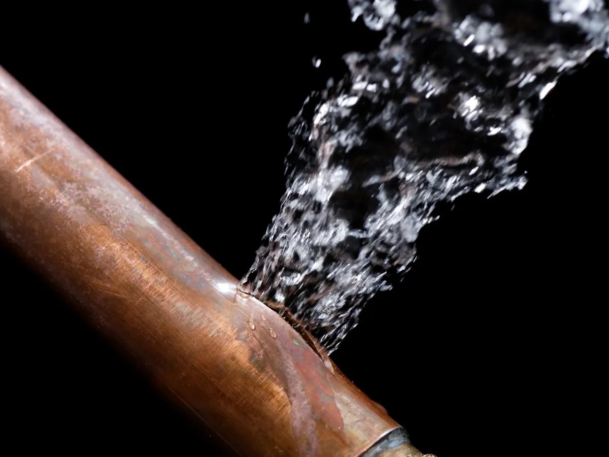 Burst pipe spraying water