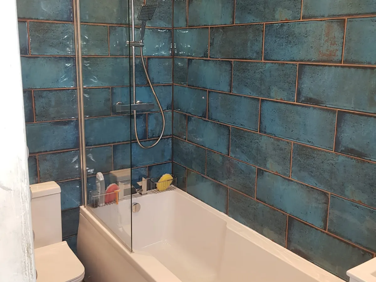 Finished bathroom refit with teal metallic tiling