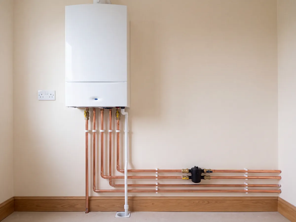 Newly fitted combi boiler with tidy copper pipework